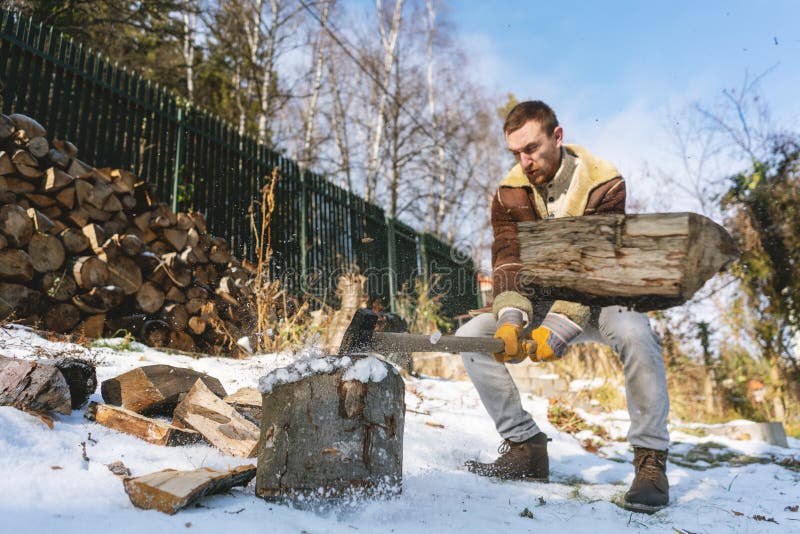 Man Chopping Wood with an Axe, Pieces and Debris Flying Around Stock ...