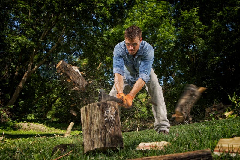 Man chopping wood in his back yard