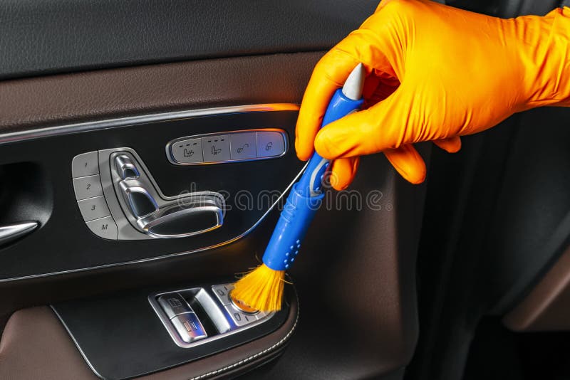 A Man Cleaning Car with Cloth and Brush. Car Detailing. Selective Focus