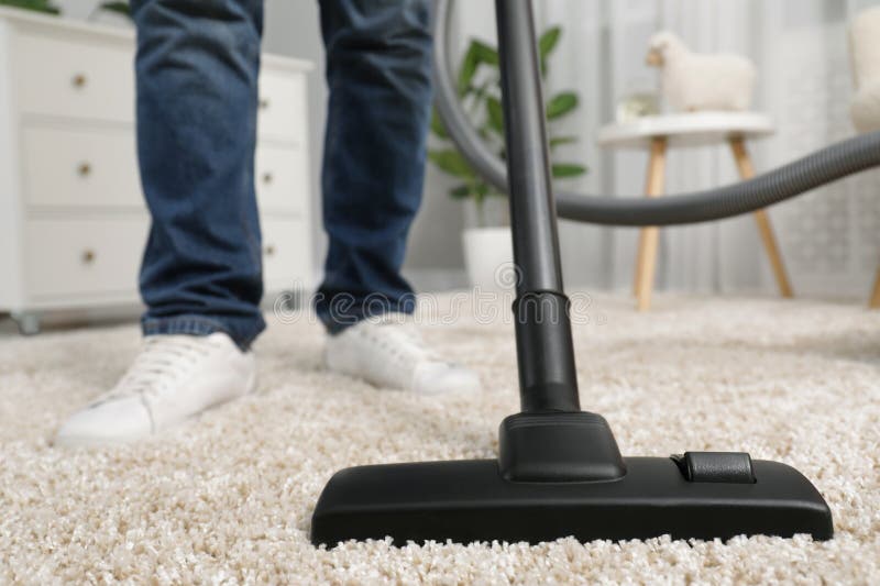Man cleaning carpet stock photo. Image of home, dust 105740800