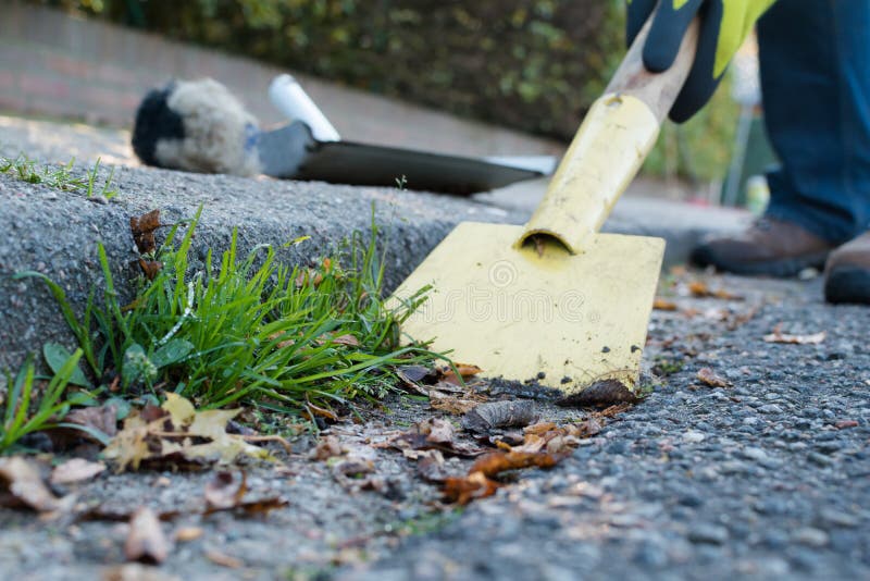 Man is cleaning the gutter stock photos