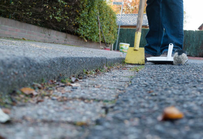 Man is cleaning the gutter stock photos