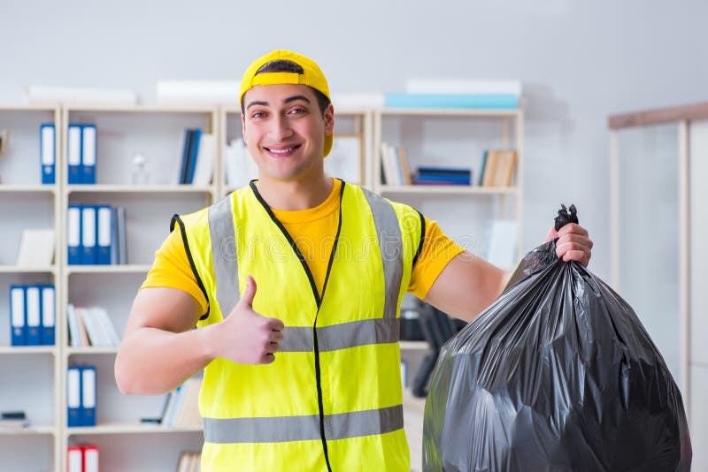 The man cleaning the office and holding garbage bag royalty free stock photo The man cleaning the office and holding garbage bag royalty free stock photo