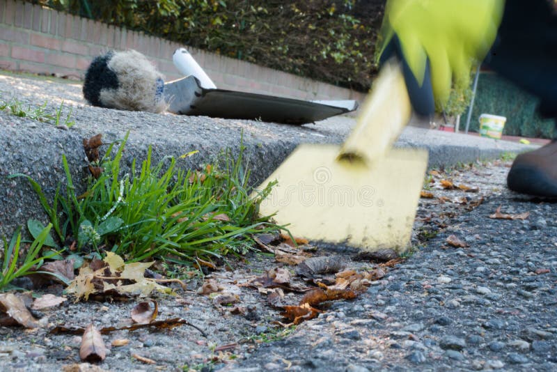Man is cleaning the gutter stock images