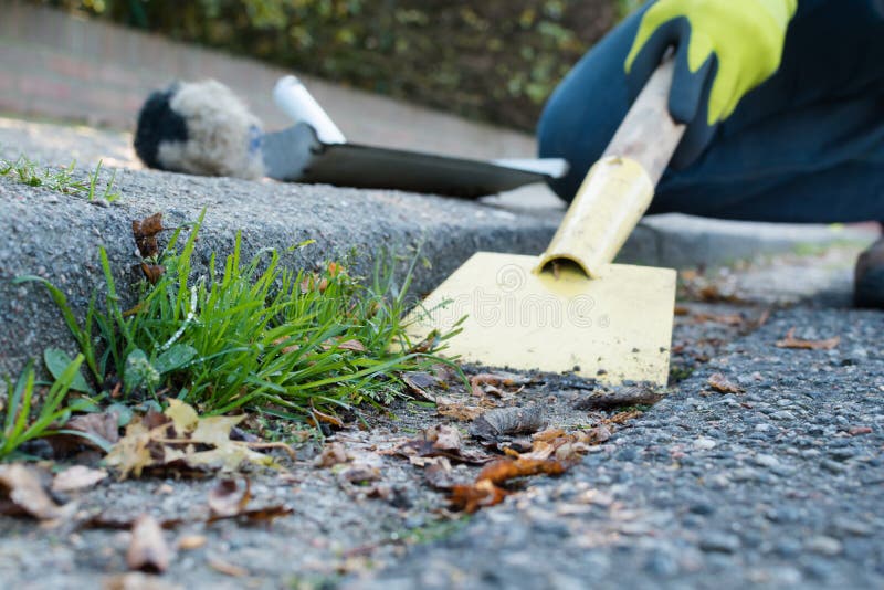 Man is cleaning the gutter royalty free stock photos