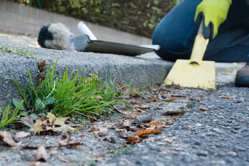 Man is cleaning the gutter royalty free stock photography