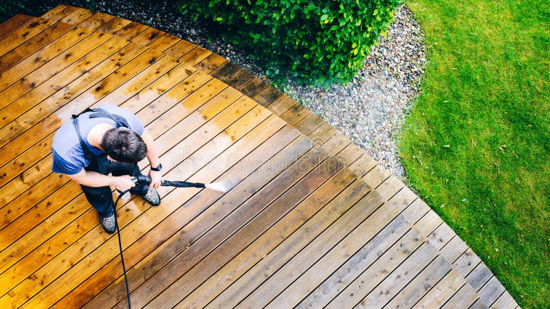 man cleaning terrace with a power washer - high water pressure c royalty free stock images man cleaning terrace with a power washer - high water pressure c royalty free stock images
