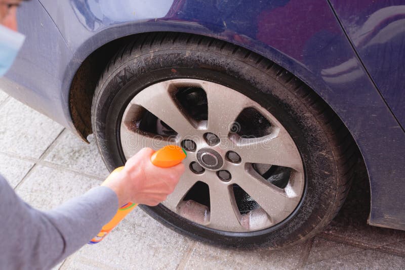 Man Cleaning the Wheel of the Car. Car Wash Stock Photo Image of