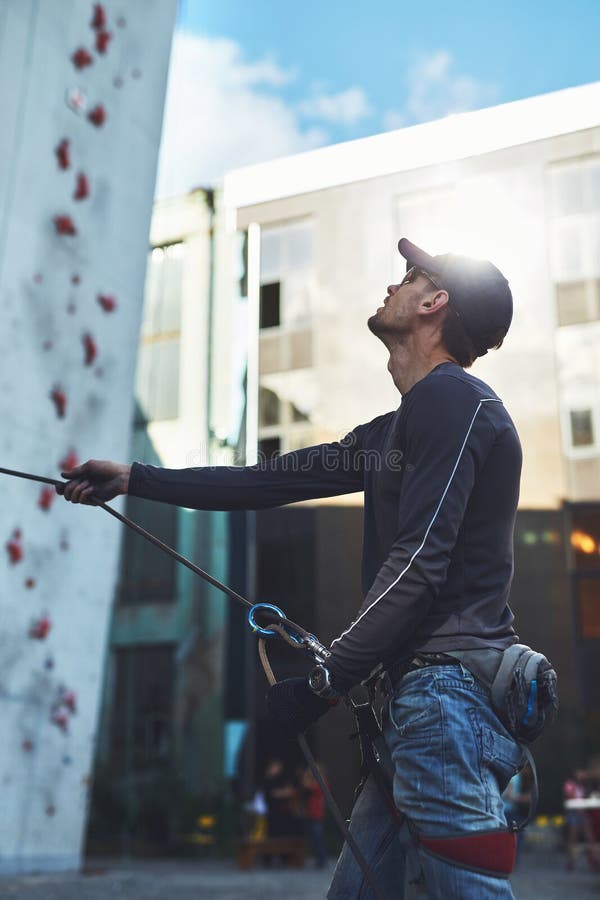 Man Climber Belays Partner on the Open Climbing Gym Stock Photo Image