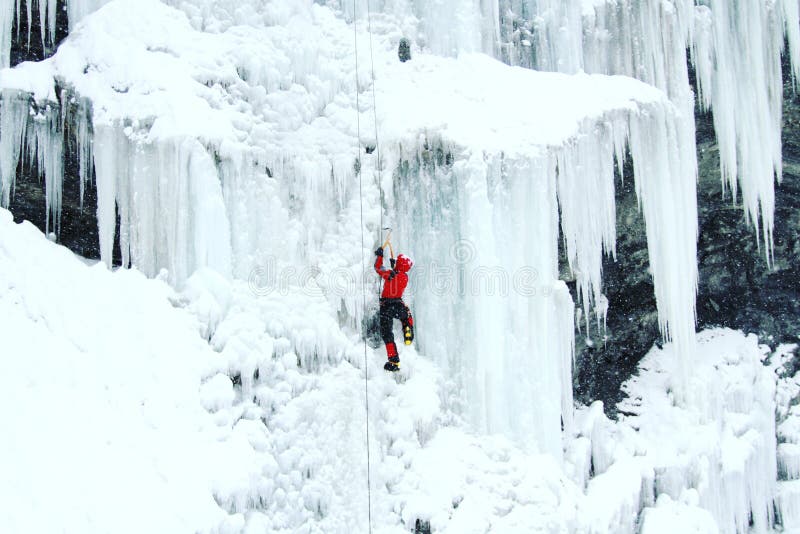 Man Climbing Frozen Waterfall. Stock Image - Image of edge, confidence ...