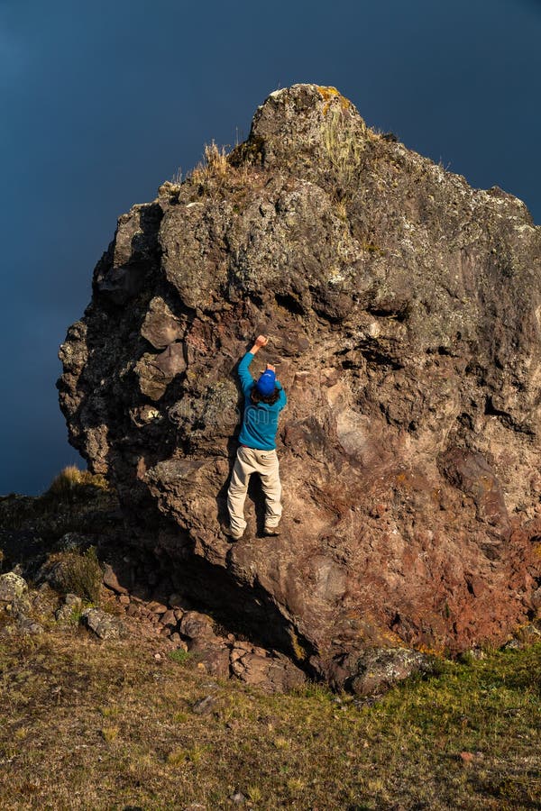 Man climbing a rock stock image. Image of natural, rock 129883761