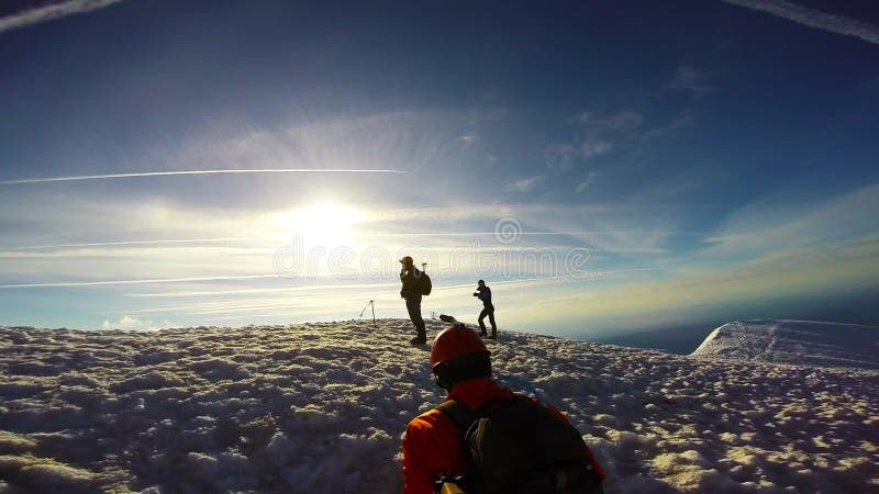 Man Climbing Up Snowy Mountain Ice Axe and Crampons stock video footage