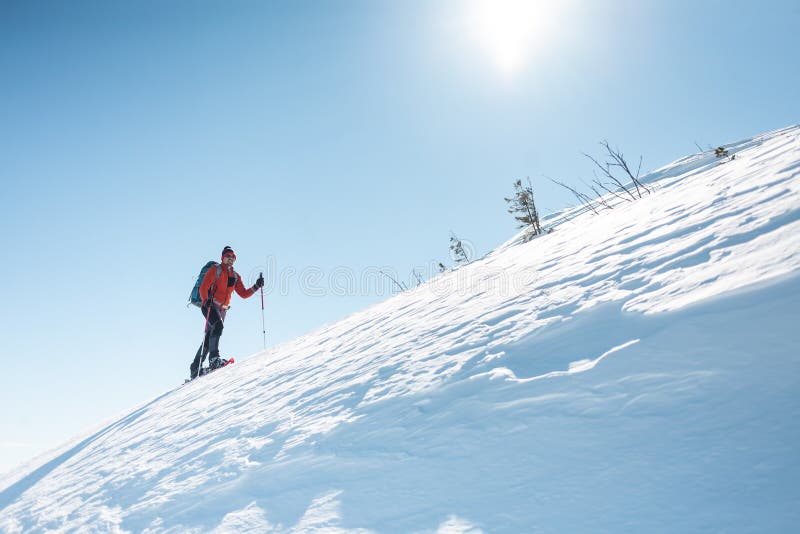 A man climbs to the top of the mountain. royalty free stock photography A man climbs to the top of the mountain. royalty free stock photography