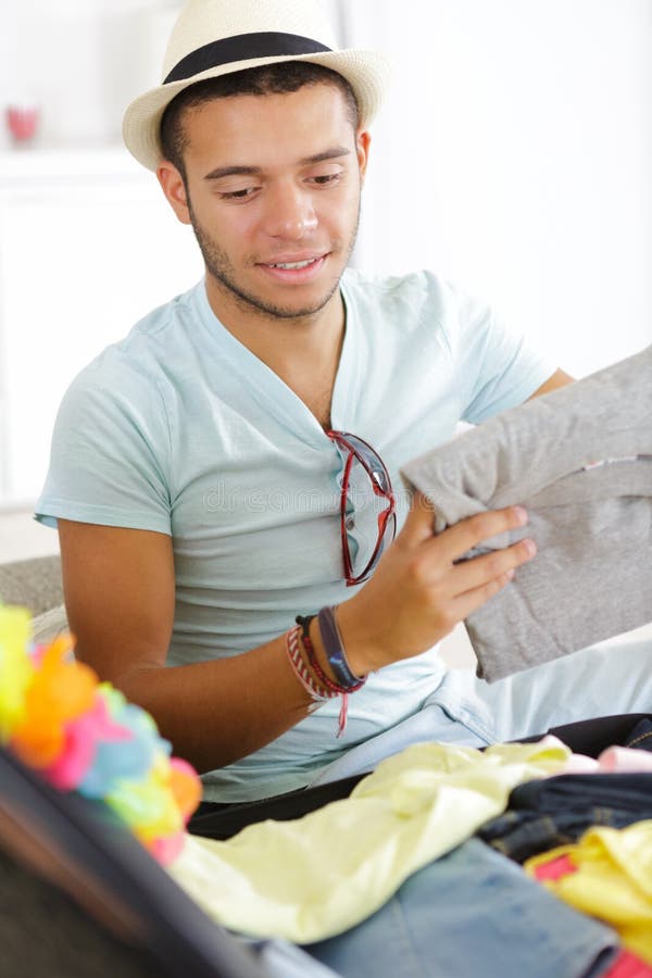 Man closing suitcase stock image. Image of pack, luggage 263895423