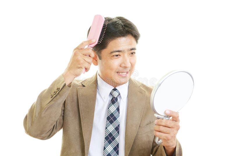 Asian Businessman Combing Hair Stock Photos Free & RoyaltyFree Stock