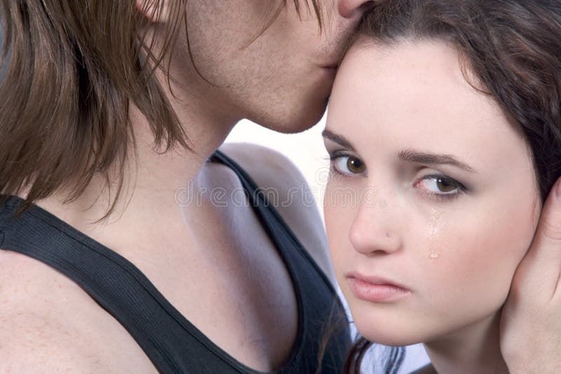 Man comforting crying distressed young woman in tears. Together is easier to overcome the stress and disappointment. Man comforting crying distressed young woman in tears. Together is easier to overcome the stress and disappointment.