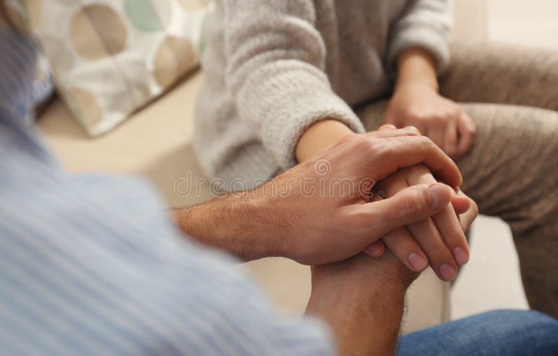 Man comforting woman, closeup of hands. Help and support concept