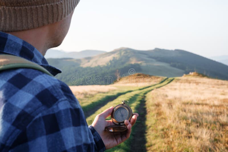 Man with compass in hand