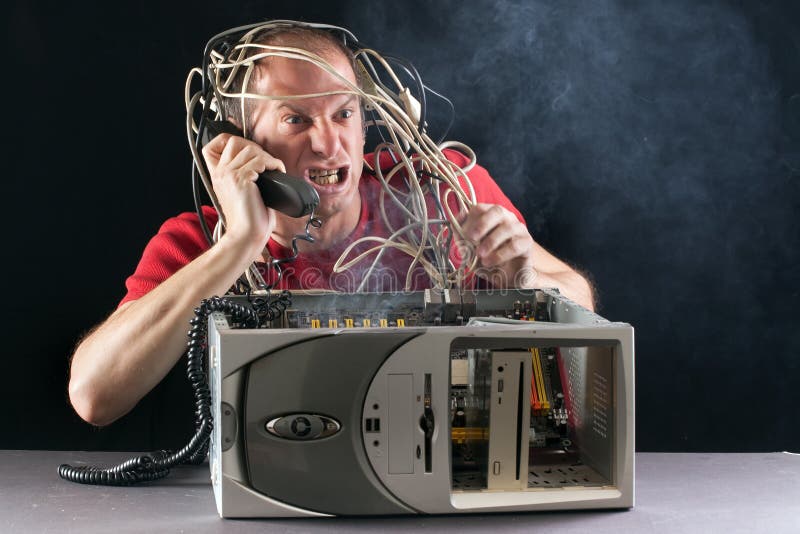 Man and computer burning royalty free stock photos
