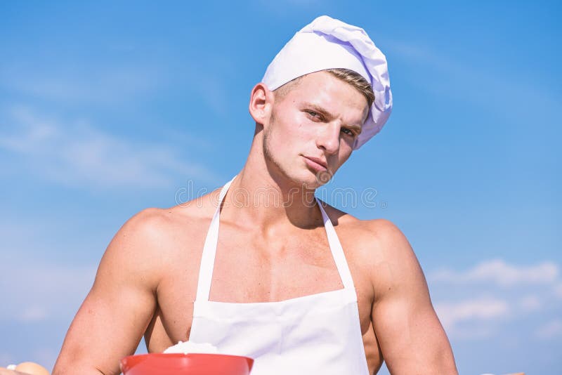 Man On Confident Face Wears Cooking Hat And Apron Sky On Background Cook Or Chef With Muscular 