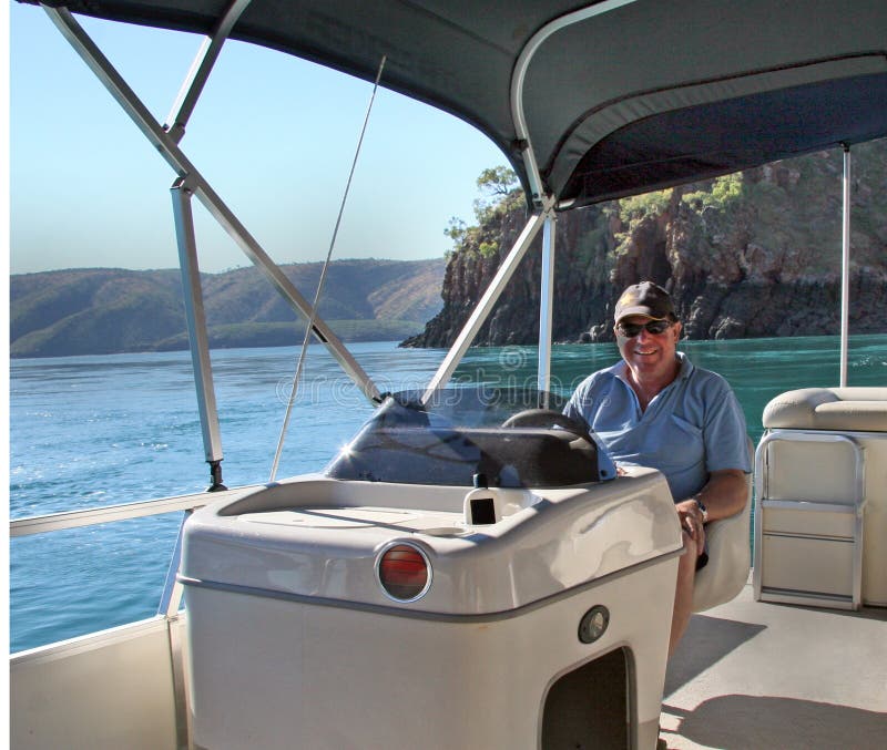 Man at Console of Party Pontoon