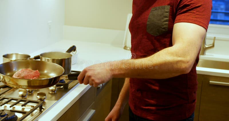 Man cooking in kitchen 4k