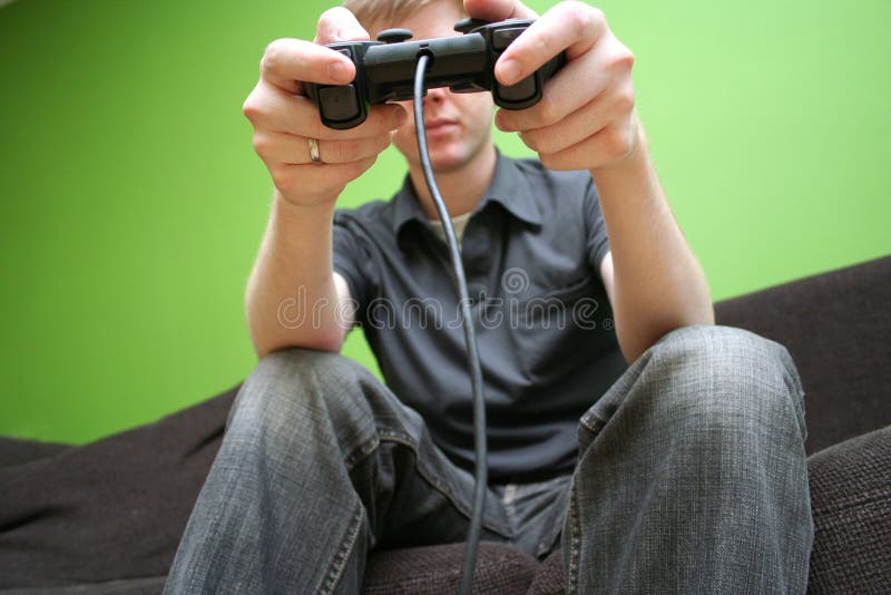 Man on Couch Playing Video Games Stock Image Image of games, video