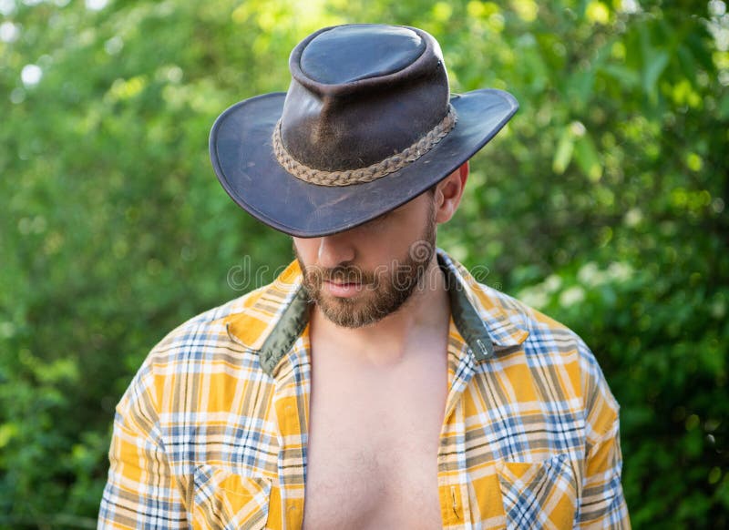 Man in Cowboy Hat Look Down. Cowboy in Checkered Shirt Stock Image ...