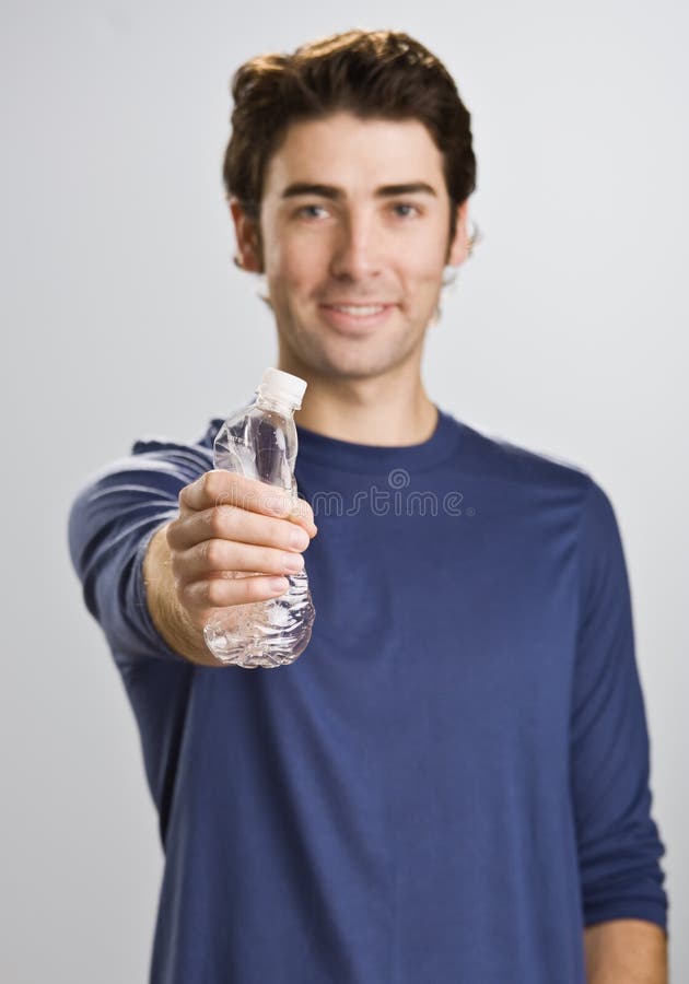 Man Crushing Water Bottle stock photo. Image of person 10679090