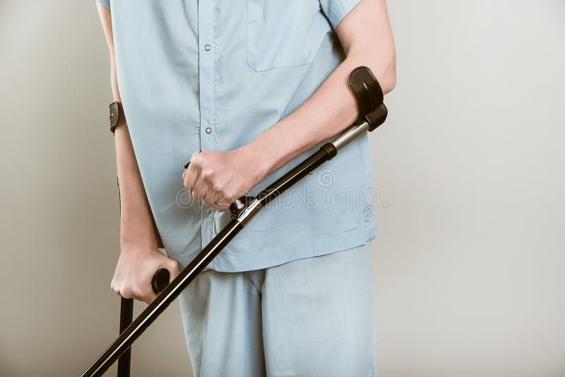 Man with crutches stock photo. Image of holding, adult 50109252
