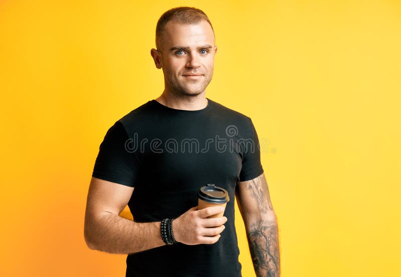 Man with cup of coffee in hand stock photography