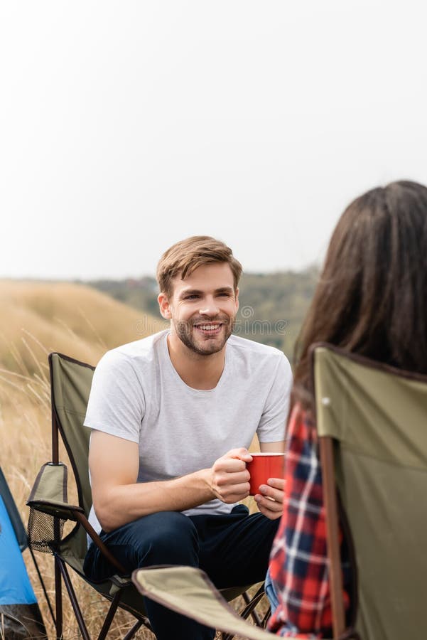 Man with Cup Looking at Girlfriend Stock Image - Image of blur, field ...