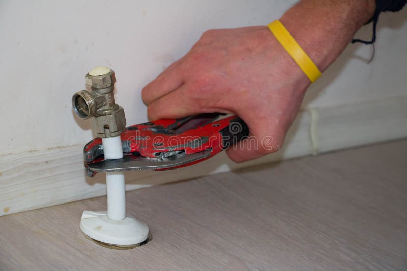 Man Cut Plastic Pipe Radiator with Scissors Stock Image Image of