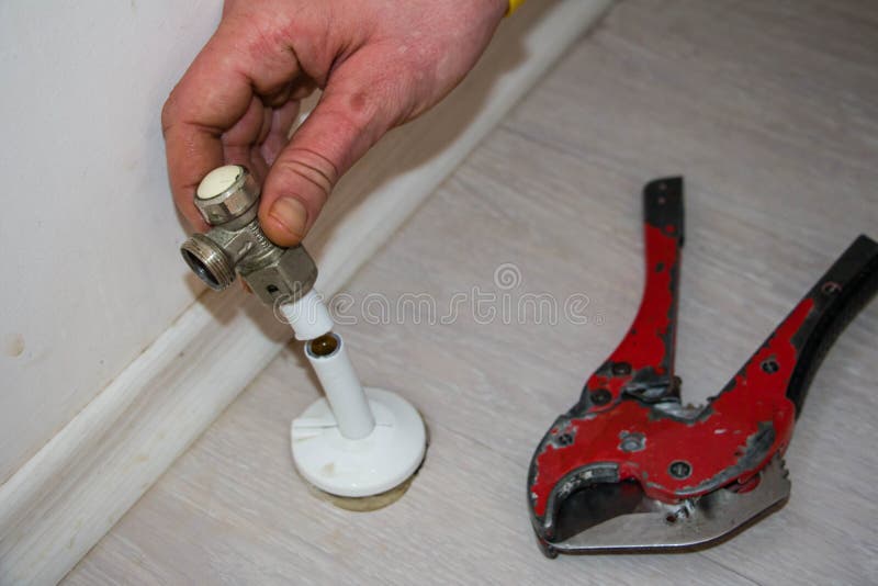 Man Cut Plastic Pipe Radiator with Scissors Stock Image Image of