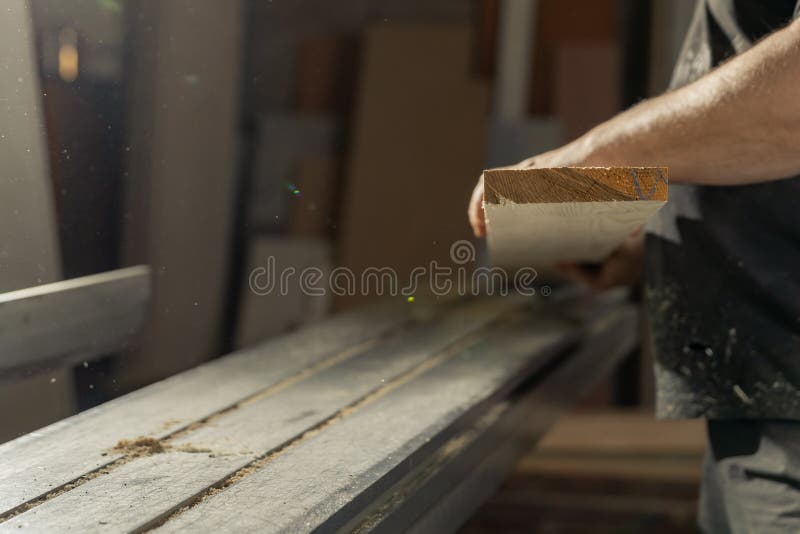 A Man Cuts Wood on a Circular Saw in a Joinery Stock Image Image of