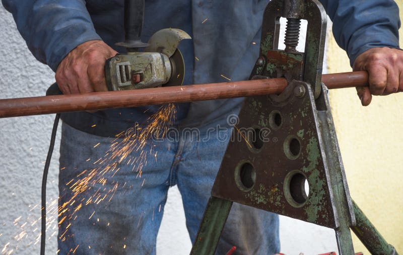 Man Cutting a Gas Pipe for Central Gas Installation Stock Photo Image