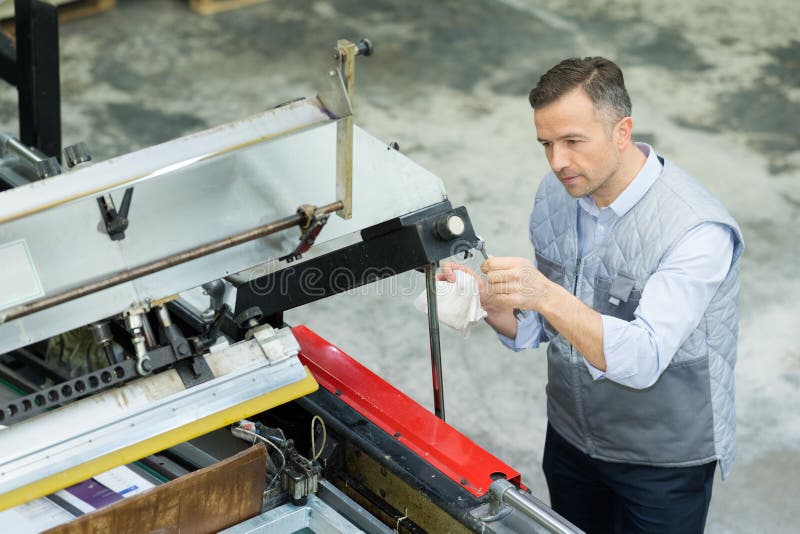 Man cutting metal pipe stock photo. Image of industry 242459624