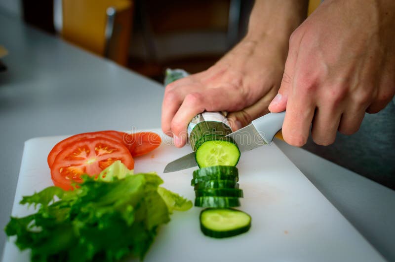 Man cutting vegetables stock image. Image of chopping - 119595773