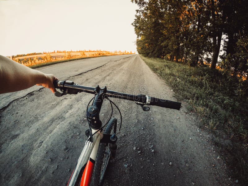 A Man Cyclist Holds a Bicycle Behind the Wheel Stock Photo Image of