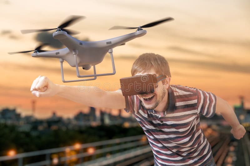 Man with 3D Virtual Reality Glasses is Controlling a Flying Drone Stock