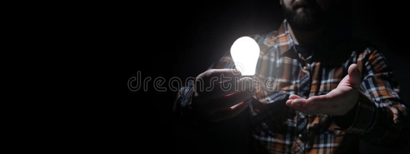 Man in dark with glow bulb