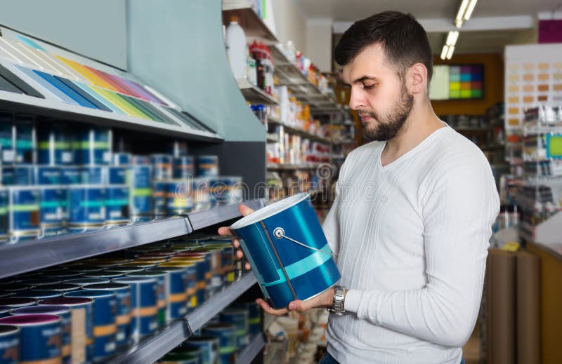 Man is deciding on best wall paint