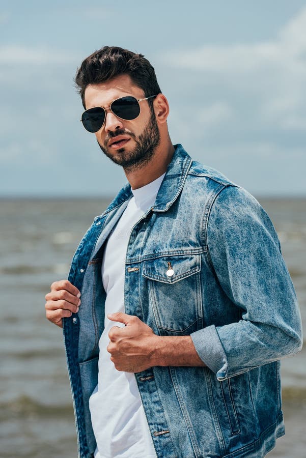 Man in Denim Jacket and Sunglasses Looking at Camera Stock Image ...