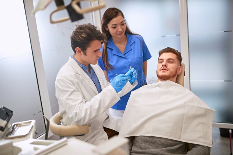 Man at Dentist in Dental Chair Stock Image - Image of equipment ...