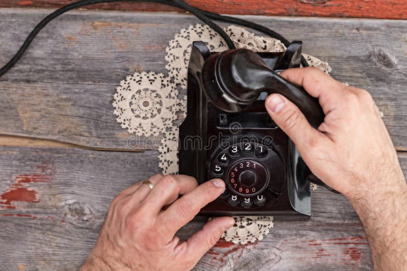 Man Dialing Out On A Landline Telephone Stock Photo - Image of center