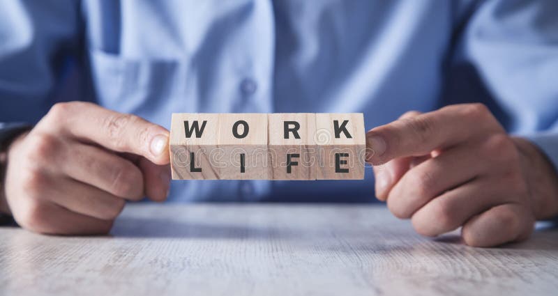 Man showing wooden cubes. Work Life Balance. Man showing wooden cubes. Work Life Balance