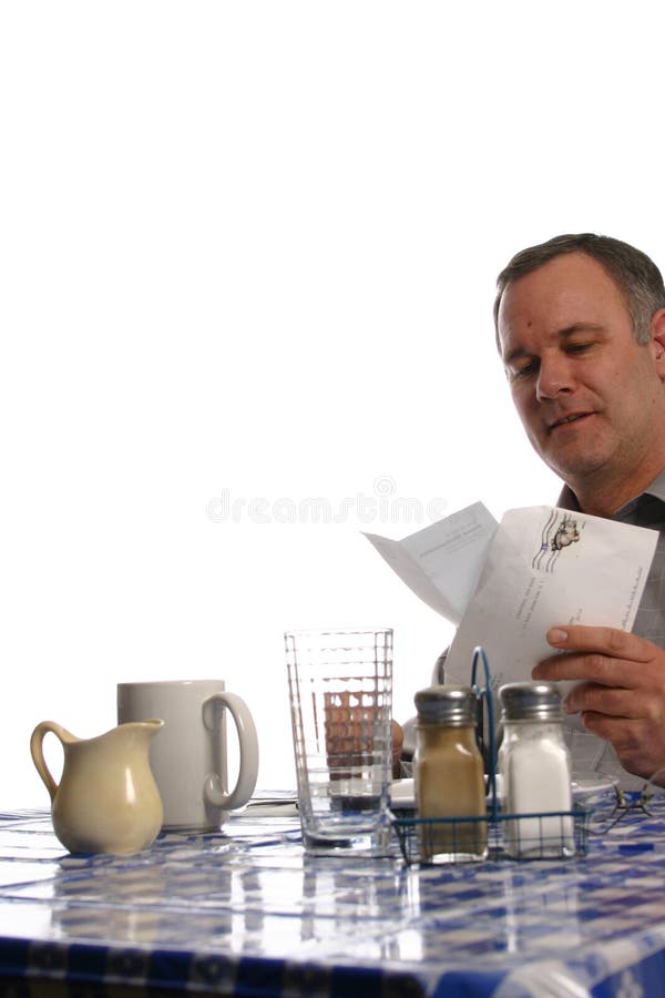 Man in diner reading letter