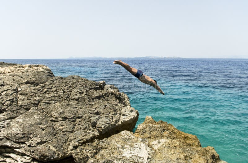 Man diving into the blue sea. stock photos Man diving into the blue sea. stock photos