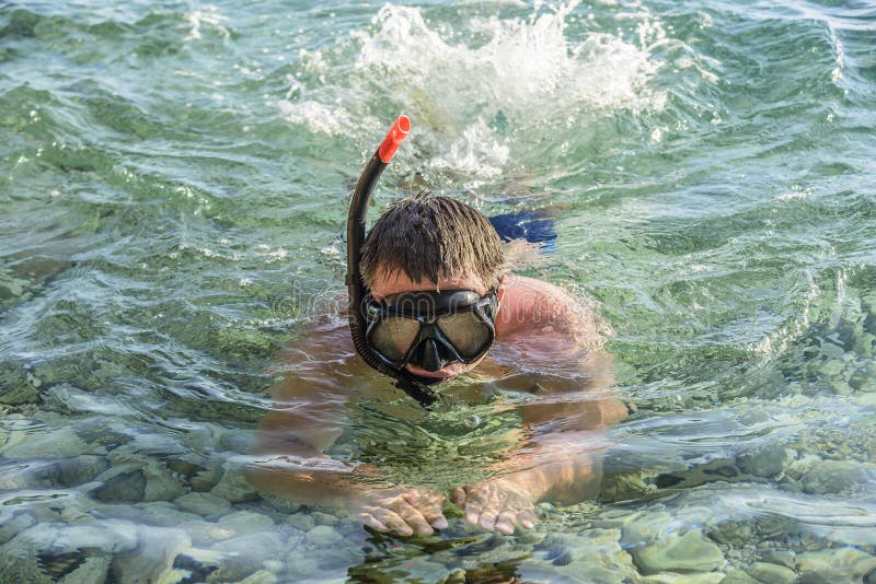 Man in a Diving Mask in Sea Water. Stock Photo Image of vacation