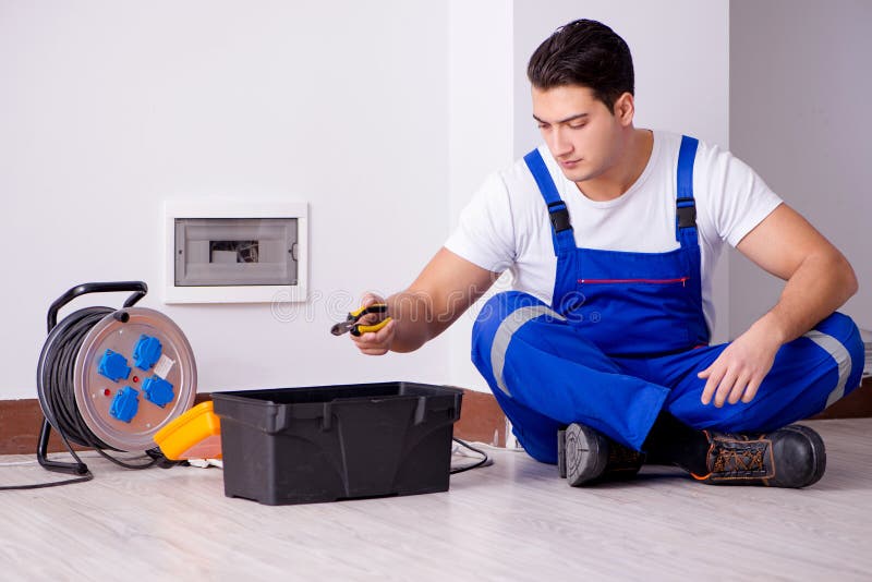 The man doing electrical repairs at home